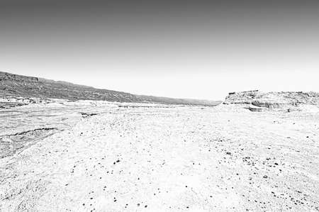 Rocky hills of the Negev Desert in Israel. Wind carved rock formations in the Southern Israel Desert. Black and white pictureの写真素材