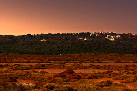 Swamp on the Shore of Atlantic Ocean in Portugal near the Village at Sunsetの写真素材