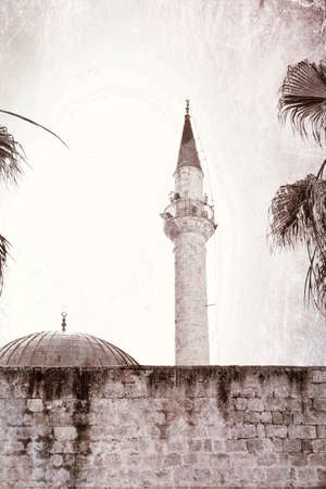 Sinan Pasha Mosque with dome in the old town of Acre, Israel. Muslim mosque and minaret in the old city of Akko. Vintage style toned pictureの写真素材