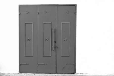 Metal gate in the old city of Akko in Israel.  Traditional Arabic style for gates in old Acre. Black and white pictureの写真素材