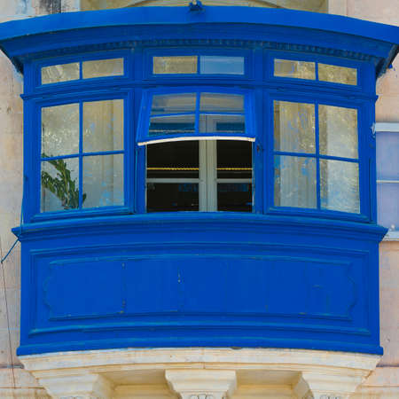 Building with traditional colorful maltese balcony in historical part of Valletta.のeditorial素材