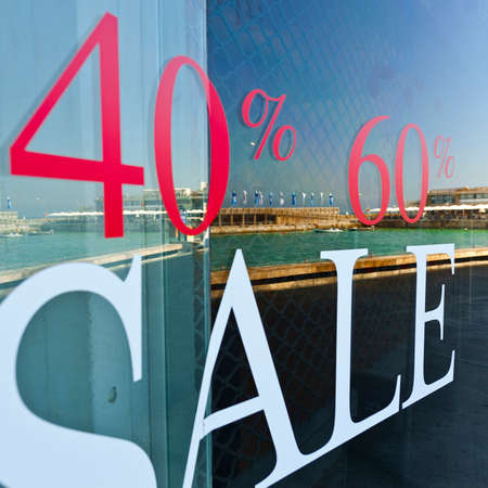 Sale Sign on Glass Window in Israelの写真素材