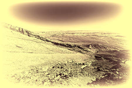 Rocky hills of the Negev Desert in Israel. Wind carved rock formations in the Southern Israel Desert. Vintage style toned pictureの写真素材