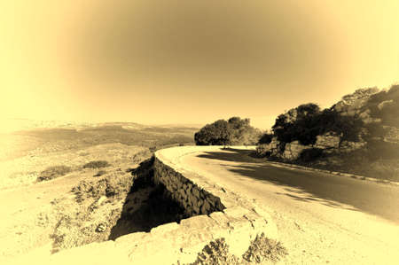 Asphalt Road Leading to the Mount Tabor in Israel, Stylized Photoの写真素材