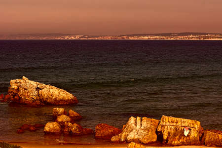 Rocky Coast of Atlantic Ocean in Portugal at Sunsetの写真素材