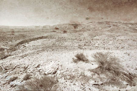 Rocky hills of the Negev Desert in Israel. Wind carved rock formations in the Southern Israel Desert. Vintage style toned pictureの写真素材