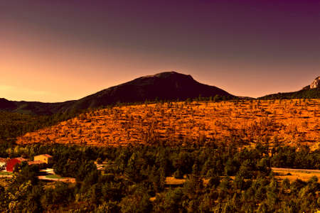 Farm High Up in the French Alps at Sunsetの写真素材