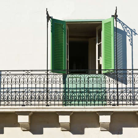 Building with traditional colorful maltese balcony in historical part of Valletta. Window on the facade of a house in Maltaの写真素材