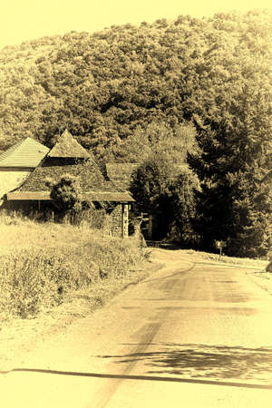 Small Town near the Winding Asphalt Road in French Alps, Stylized Photoの写真素材