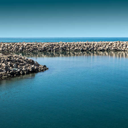 Breakwater protecting the beach of Mediterranean sea in Israel.の写真素材