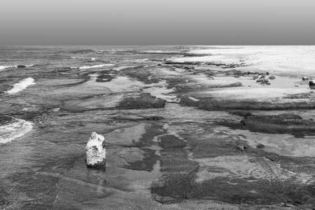 Israeli shore of the Mediterranean Sea. Rocky beach in Israel. Black and white pictureの写真素材