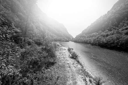 Morning mist in the Italian Dolomites.  View of the mountain lake at sunrise. Black and white picture の写真素材