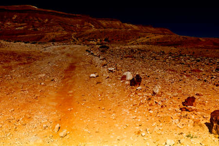 Rocky hills of the Negev Desert in Israel early in the morning. Breathtaking landscape at sunrise,...