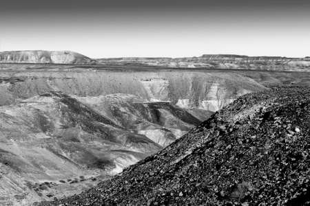 Rocky hills of the Negev Desert in Israel. Breathtaking landscape of the rock formations in the Southern Israel. Dusty mountains interrupted by wadis  and deep craters.の写真素材