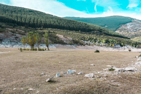Beautiful landscape in Spain with dramatic view of Cantabrian Mountains. Dry riverbed on the bottom of canyon の写真素材