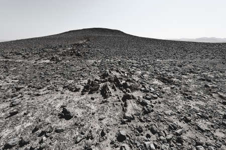 Rocky hills of the Negev Desert in Israel. Breathtaking landscape and nature of the Middle East. Black and white photoの写真素材
