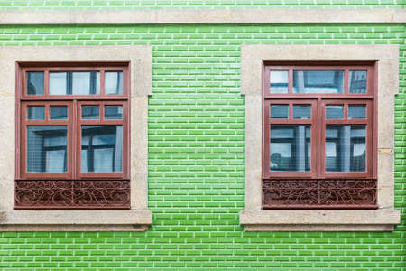Traditional Portuguese facade sometimes decorated with ceramic tiles of azulejo in the historical centre of the city of Portoの写真素材