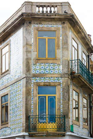 Traditional Portuguese facade sometimes decorated with ceramic tiles of azulejo in the historical centre of the city of Portoのeditorial素材