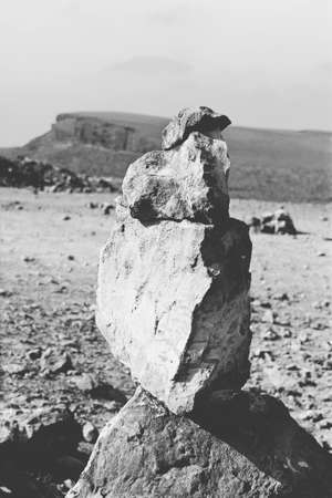 Home-made dolmen located in Negev desert in Israel. Breathtaking landscape and nature of the Middle East. Black and white photoの写真素材