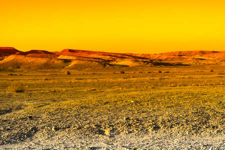 Colorful rocky hills of the Negev Desert in Israel. Breathtaking landscape and nature of the Middle East at sunsetの写真素材
