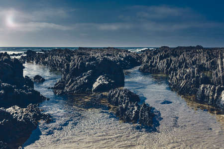 Portuguese Atlantic Ocean beach in the light of the moon. Breathtaking landscape and nature of the Portugal, popular travel destination in western Europe. の写真素材