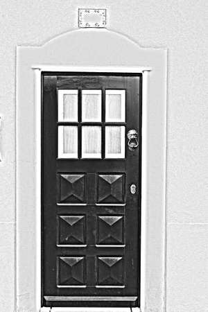 View of the historical centre of the city of Porto with traditional Portuguese facades sometimes decorated with ceramic tiles of azulejo. Black and white photoの写真素材