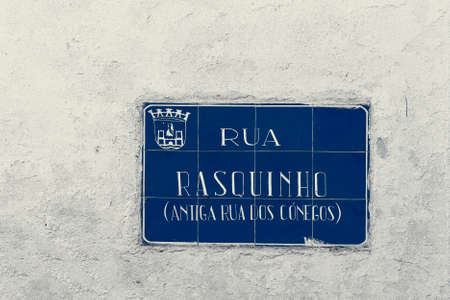 Street sign on the ancient buildings in medieval Portuguese city