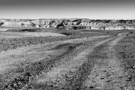 Rocky hills of the Negev Desert in Israel. Breathtaking landscape of the rock formations in the Southern Israel. Dusty mountains interrupted by wadis  and deep craters.の写真素材