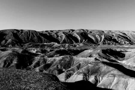 Rocky hills of the Negev Desert in Israel. Breathtaking landscape of the rock formations in the Southern Israel. Dusty mountains interrupted by wadis  and deep craters.の写真素材