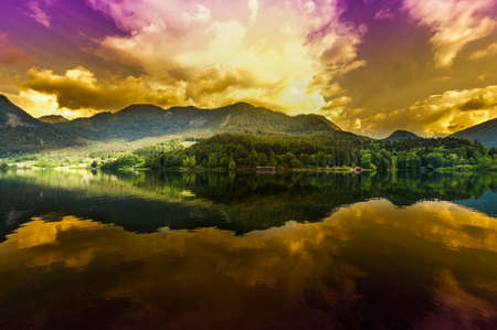 Austrian landscape with forests, meadows, fields and pastures surrounding the lake Grunlsee on the...