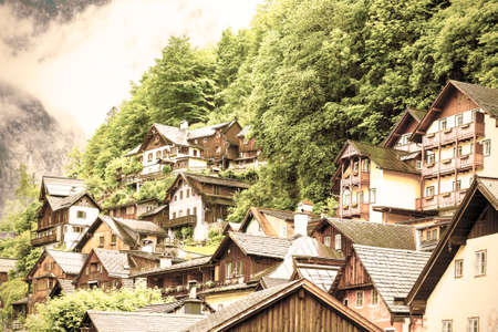 Rain and morning mist over the Austrian city of Hallstatt. Traditional Austrian medieval...