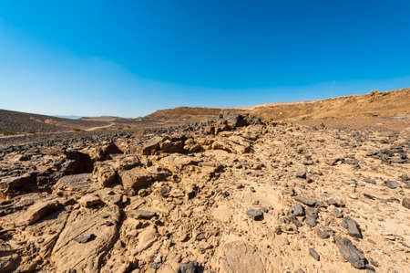 Breathtaking landscape of the rock formations in the Israel desert. Dusty mountains interrupted by wadis  and deep craters.の写真素材