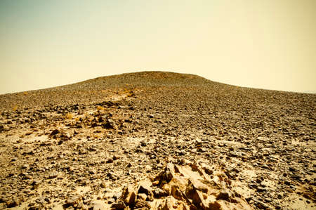 Breathtaking landscape of the rock formations in the Israel desert. Dusty mountains interrupted by...