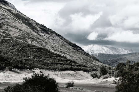 Beautiful landscape in Spain with dramatic view of Cantabrian Mountains. Dry riverbed on the bottom of canyon の写真素材