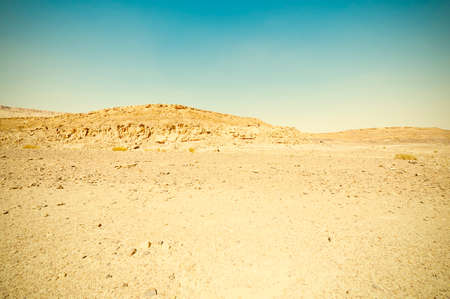 Breathtaking landscape of the rock formations in the Israel desert. Dusty mountains interrupted by...