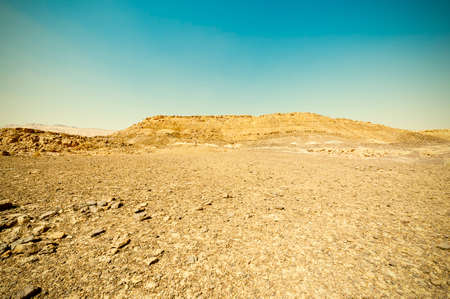 Breathtaking landscape of the rock formations in the Israel desert. Dusty mountains interrupted by...