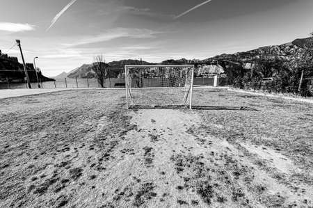 Deserted sports field on the shores of Lake Garda in Italy in black and white.の写真素材