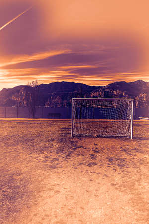 Deserted sports field on the shores of Lake Garda in Italy at dawn in a contemporary style.の写真素材