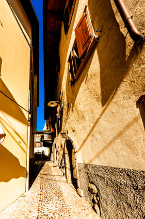 Narrow medieval street of the Italian town Lazise on the shores of Lake Gardaの写真素材