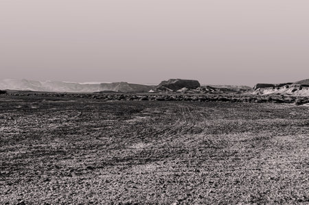 Breathtaking landscape of the rock formations in the Israel desert in black and white. Lifeless and desolate scene as a concept of loneliness, hopelessness and depression.の写真素材