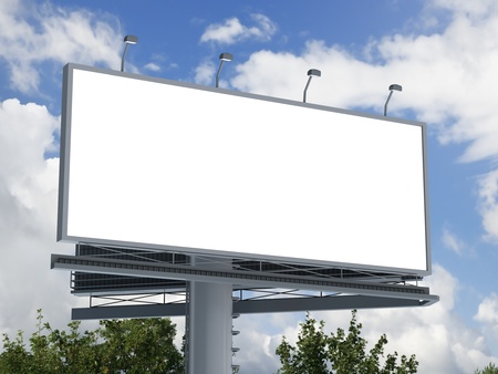 Billboard with empty screen, against blue cloudy skyの写真素材