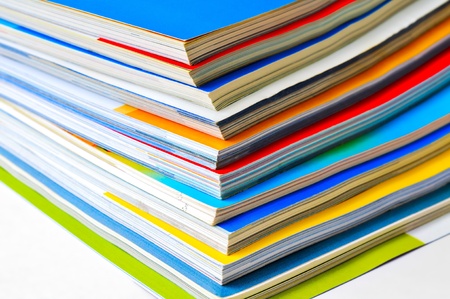 Pile of colorful magazinesの写真素材
