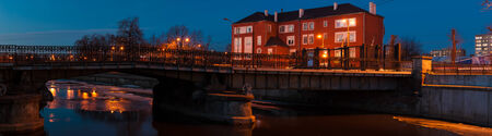 Kaliningrad. View of the pedestrian bridge (HonigbrÃ¼cke) and buildings on the banks of the river Pregolyaのeditorial素材