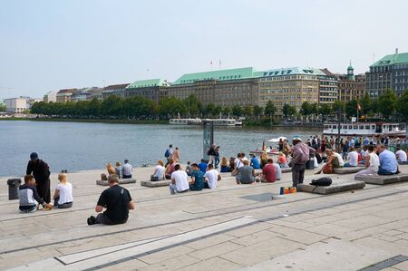 HAMBURG, GERMANY - AUGUST 14, 2015: People resting to Binnenalster Lake, Binnenalster or Inner...