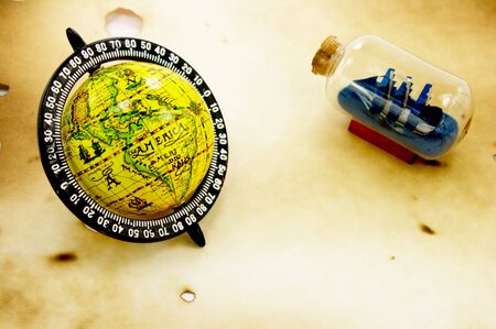 Globe and bottle with ship grunge backgroundの写真素材
