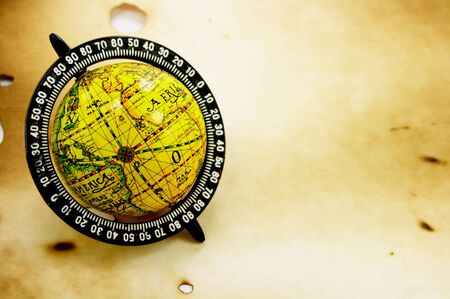 Antique globe on grunge background