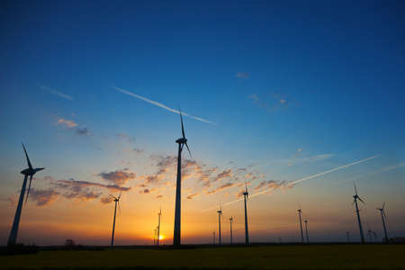 Wind turbines with sunset sky
