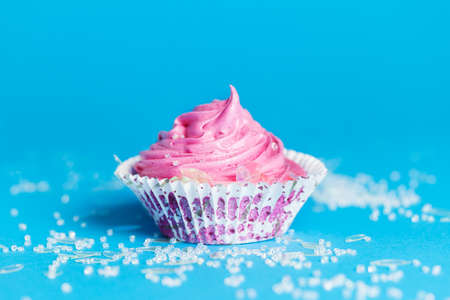 Marshmallow cupcake on blue backgroundの写真素材