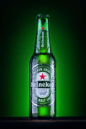 Orhei, Moldova - June 4, 2020 : Bottle of Heineken Lager Beer on green background. Heineken is the flagship product of Heineken Internationalのeditorial素材