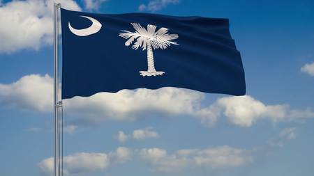 Flag of South Carolina - US state fluttering in the wind against a cloudy sky 3d renderingの写真素材